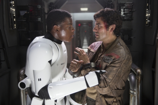 Star Wars: The Force Awakens..L to R: Finn (John Boyega) and Poe Dameron (Oscar Isaac)..Ph: David James..© 2015 Lucasfilm Ltd. & TM. All Right Reserved.